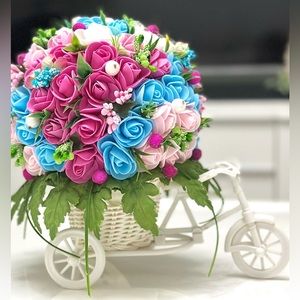 Handmade artificial flowers in a bicycle centerpiece